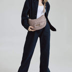 Lieblingstasche Lifetime Buddy S quilted taupe crossbody bag worn by a model in dark denim outfit