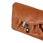 Lieblingstasche Mabel brown leather clutch bag with a unique black metal clasp closure