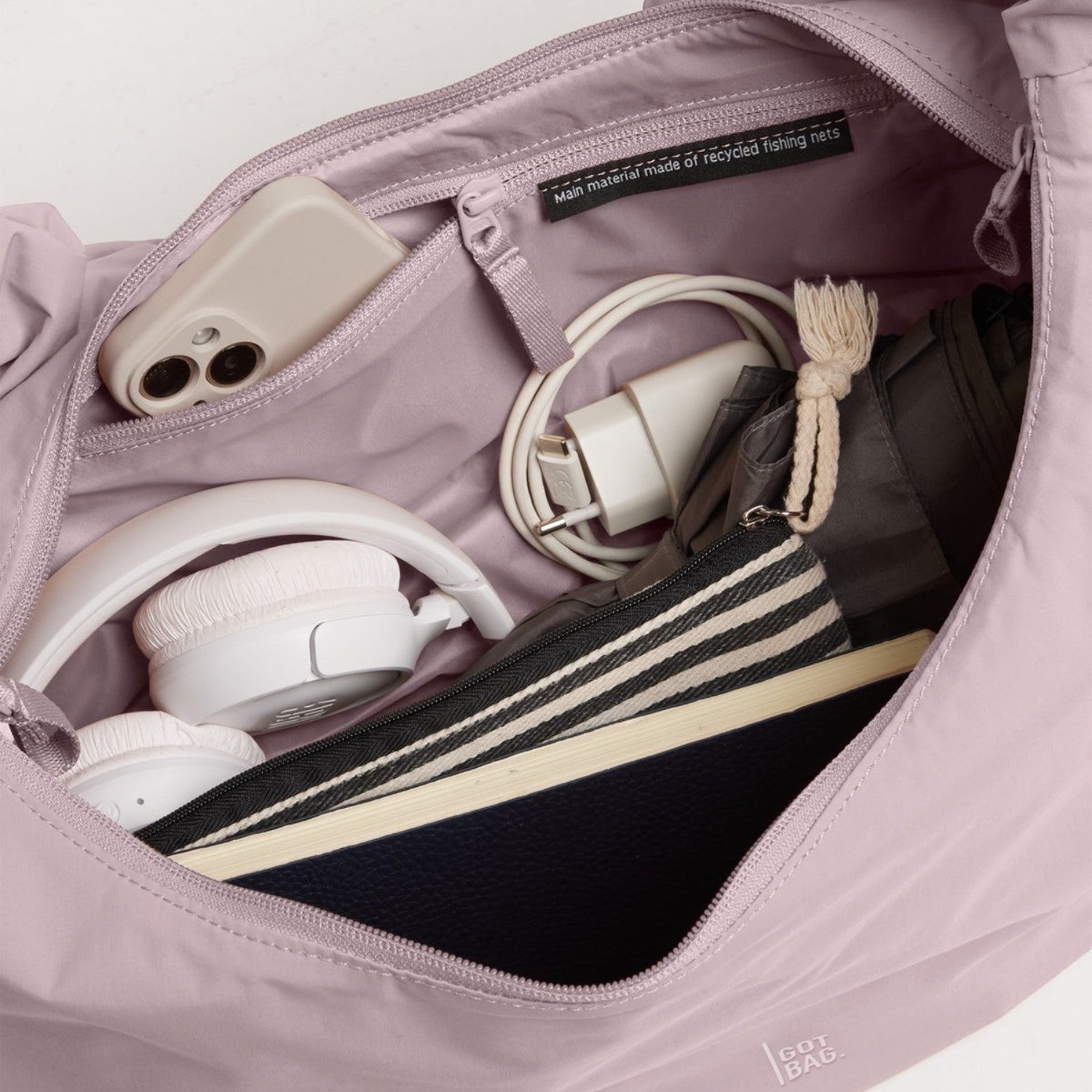 Lieblingstasche Moon Bag Ruffle Large in dusty purple, showing the spacious interior with organized accessories.