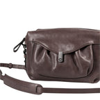 Lieblingstasche Mrs. Cannoli dark brown leather crossbody bag with a gathered flap and metal clasp closure.
