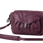 Lieblingstasche Mrs. Cannoli purple leather crossbody bag with a soft gathered front flap and metal clasp closure.