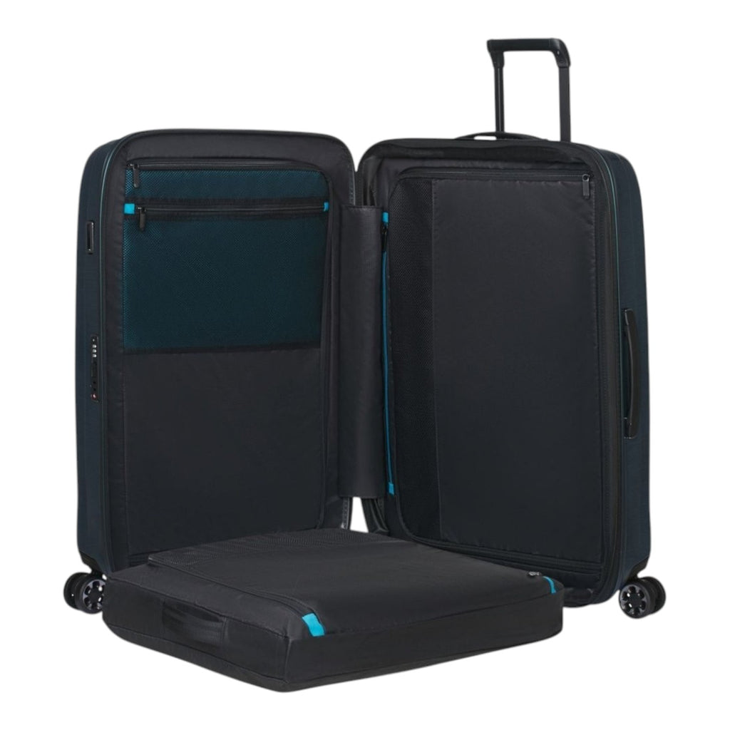 Lieblingstasche NEXIS Spinner 76/28 Exp suitcase opened to show black interior lining and blue zipper accents