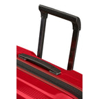 Lieblingstasche NUON Spinner 75/28 suitcase featuring a bright red hard shell and black retractable telescopic handle