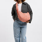 Lieblingstasche large moon bag in orange and white gingham pattern, with a ruffled strap.