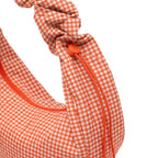 Lieblingstasche large moon bag with orange and white gingham pattern and adjustable drawstring strap.