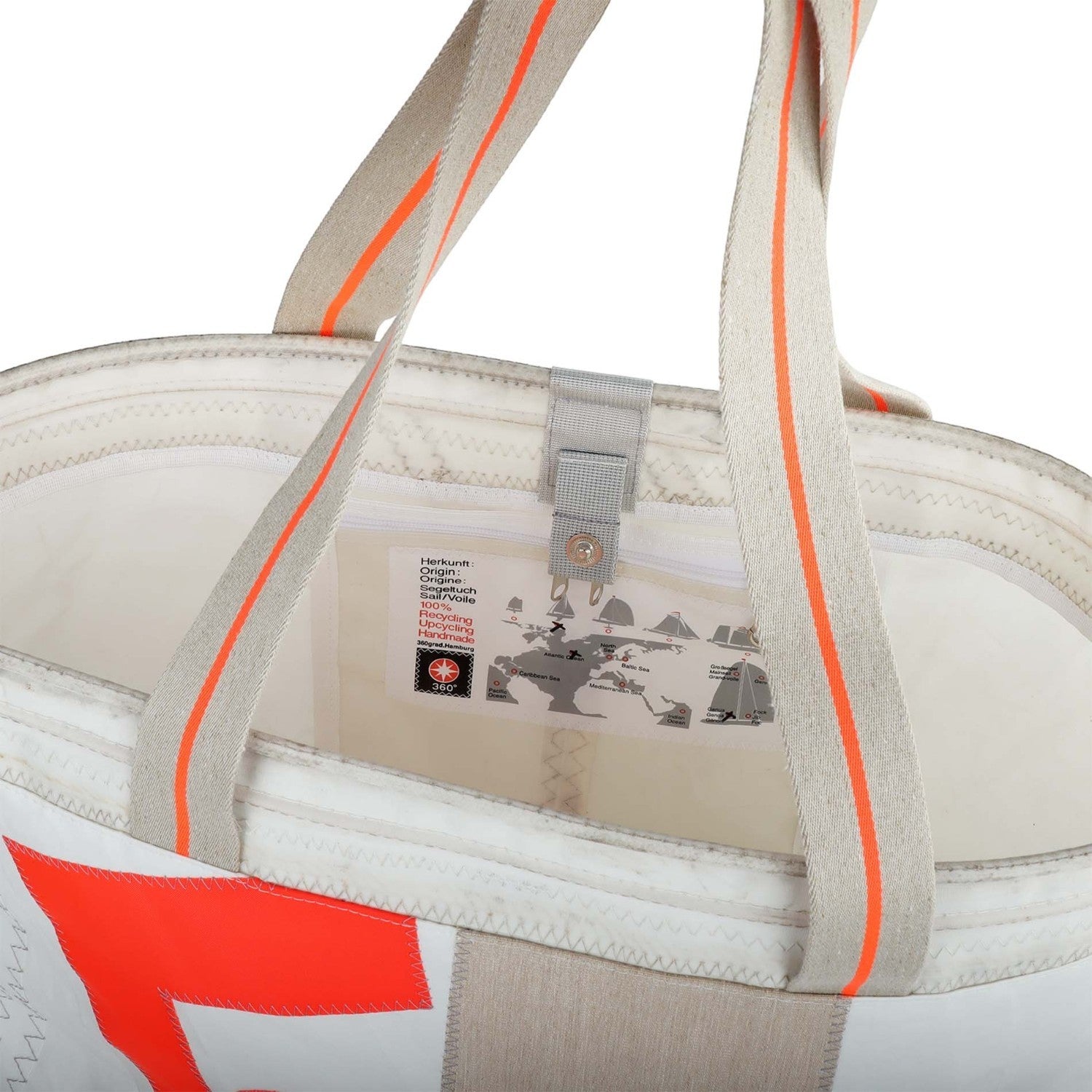 Lieblingstasche white tote bag made from recycled sailcloth with orange accents and a world map detail.