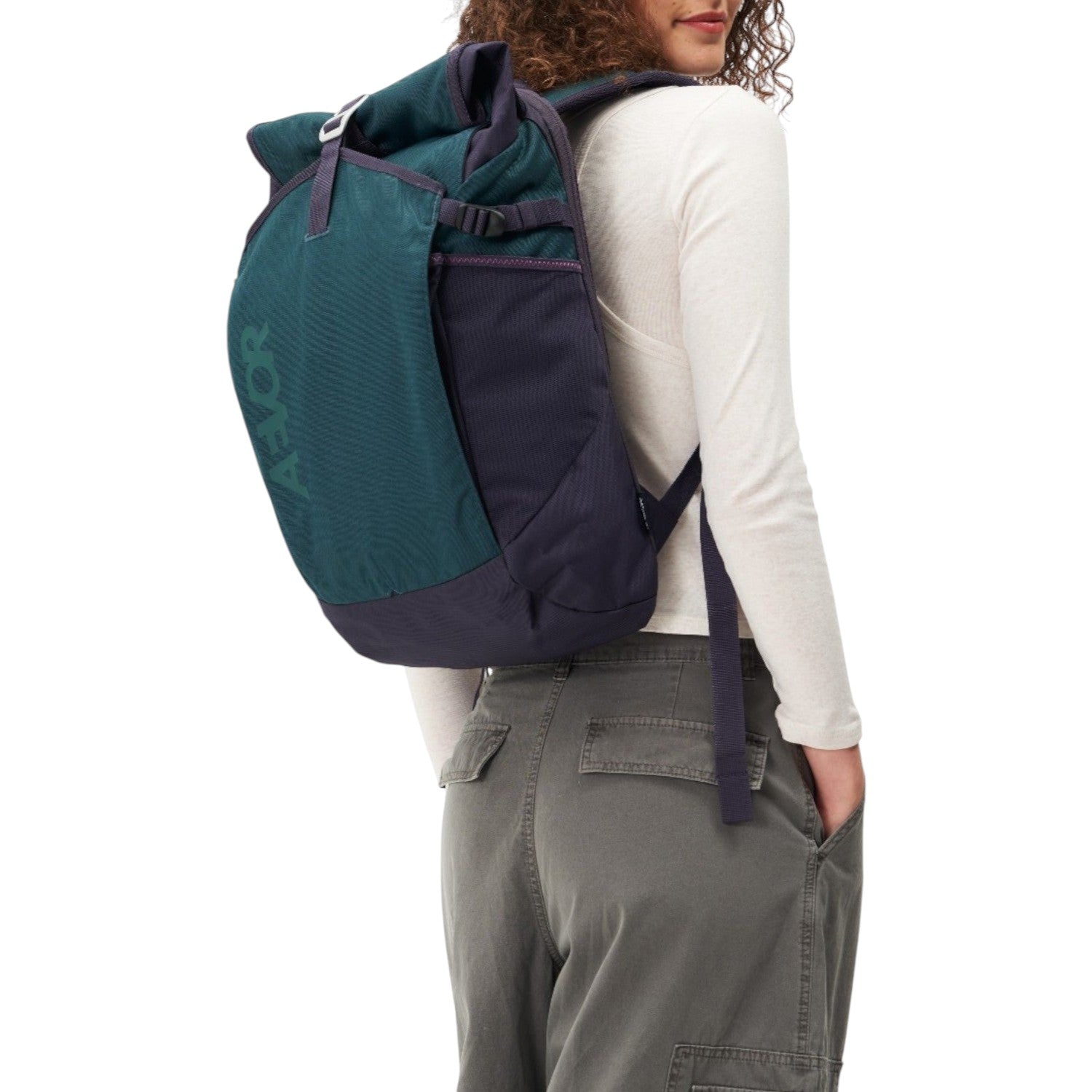 Lieblingstasche Roll Pack 2.0 backpack in dark green and navy blue worn by a woman against a white background