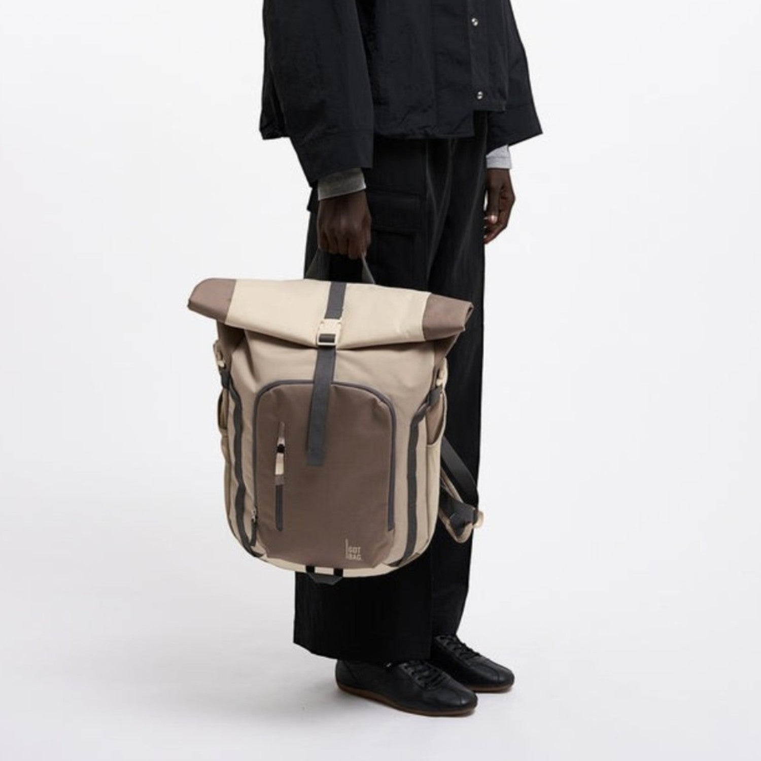 Lieblingstasche Rolltop Adventure backpack in beige and brown canvas with multiple pockets and adjustable straps.