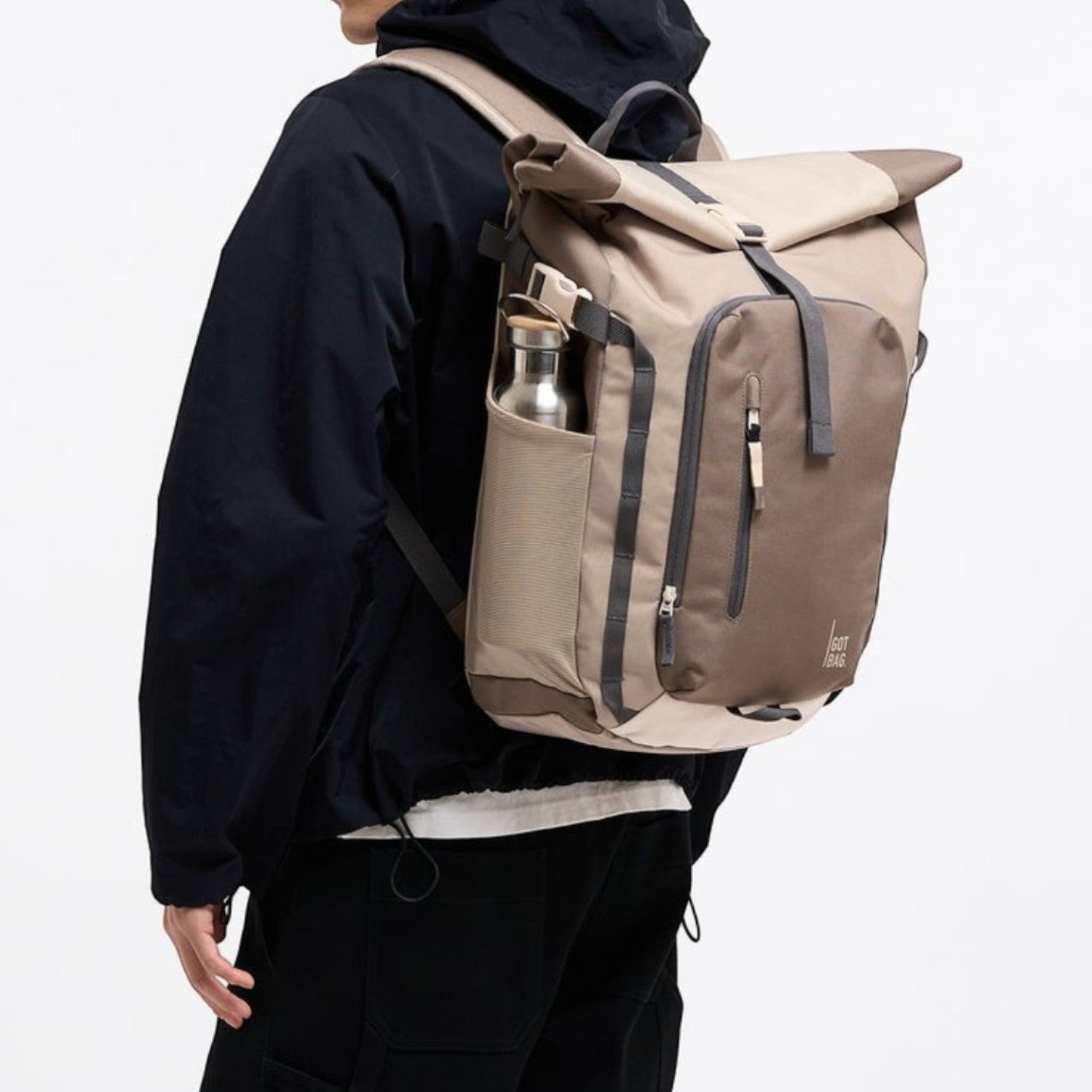 Lieblingstasche Rolltop Adventure backpack in beige and brown with grey accents, featuring a water bottle pocket.