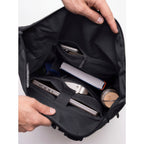 Lieblingstasche Rolltop Adventure backpack interior with laptop, book, phone, and water bottle