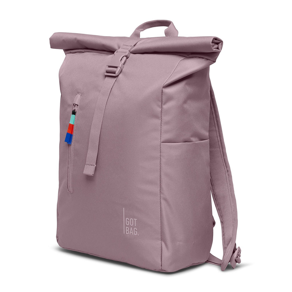 Lieblingstasche Rolltop Easy backpack in dusty rose, with a roll-top closure and buckle, side pocket, and colorful zipper pull.