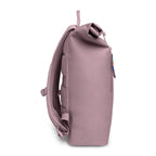 Lieblingstasche Rolltop Lite 2.0 backpack in dusty rose, with padded straps and a small colorful zipper pull.