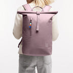 Lieblingstasche Rolltop Lite 2.0 backpack in dusty rose with a front zip pocket and colorful zipper pull.