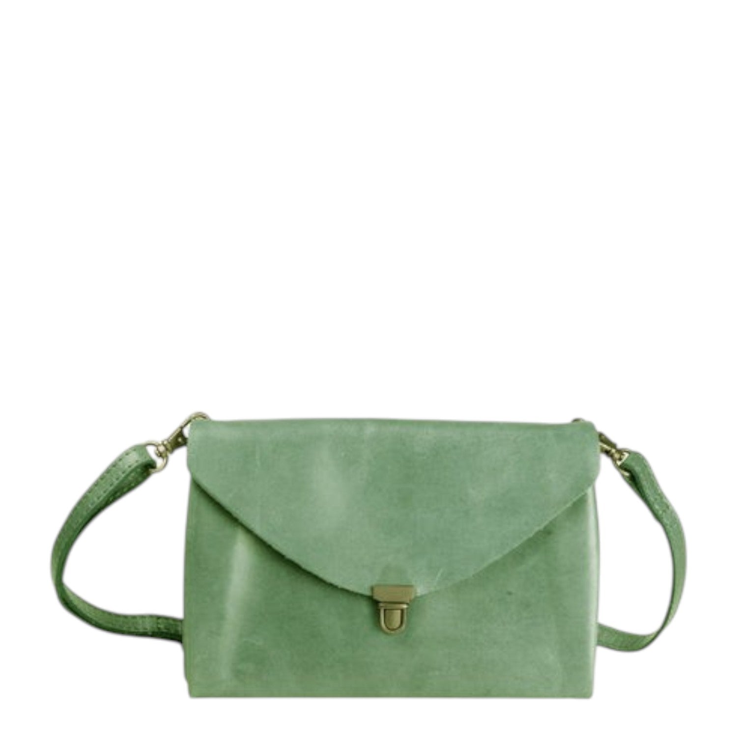 Lieblingstasche Fold Handbag Clutch M in sage green suede with a turn-lock closure and adjustable strap.