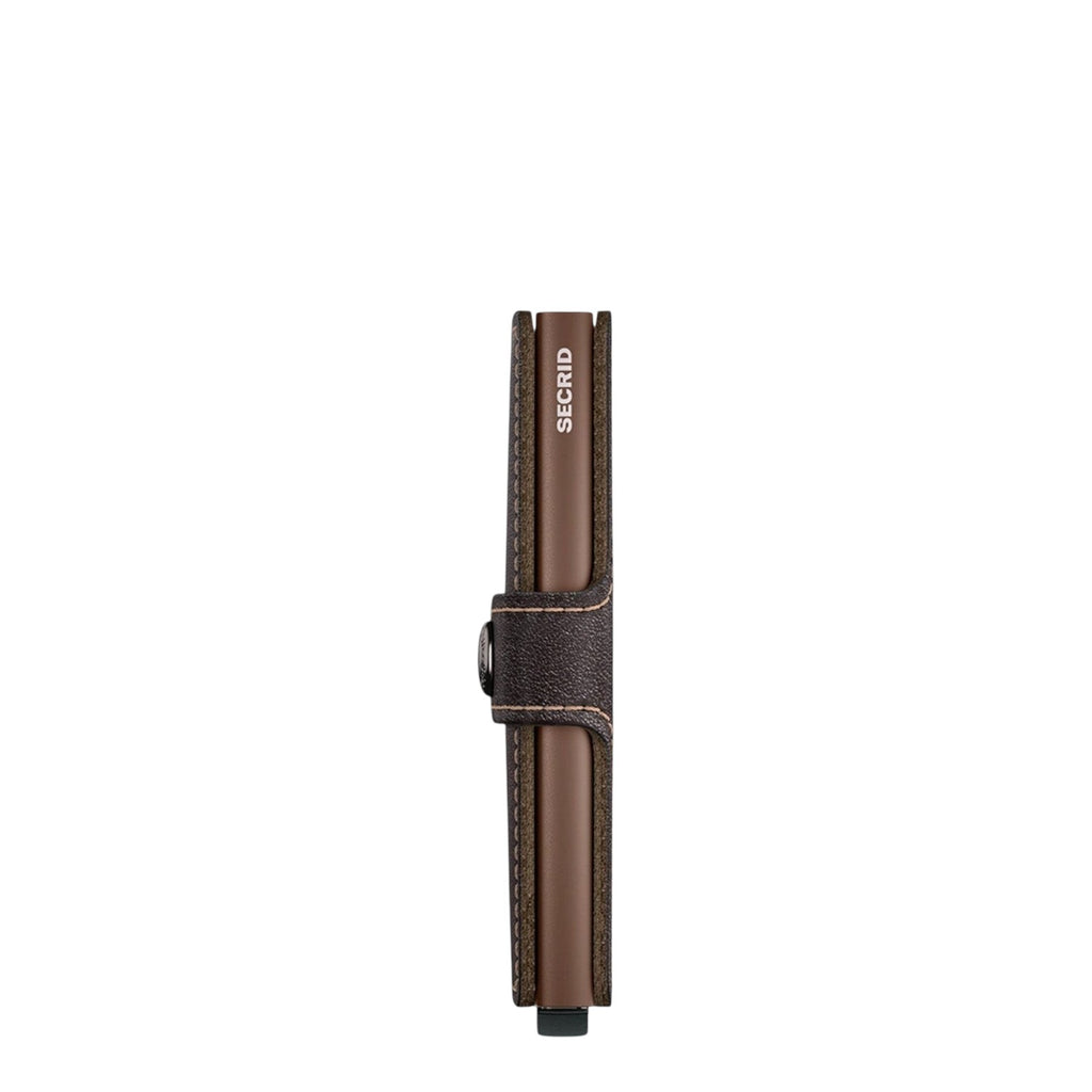 Lieblingstasche Secrid Miniwallet in brown leather with a secure snap closure and RFID-protected card mechanism.