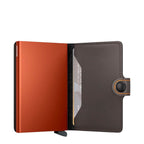Lieblingstasche Secrid Miniwallet Matte in orange with a dark brown leather cover and RFID protection mechanism.