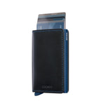 Lieblingstasche Secrid Slimwallet in black leather with blue stitching and a blue RFID-protected card mechanism.