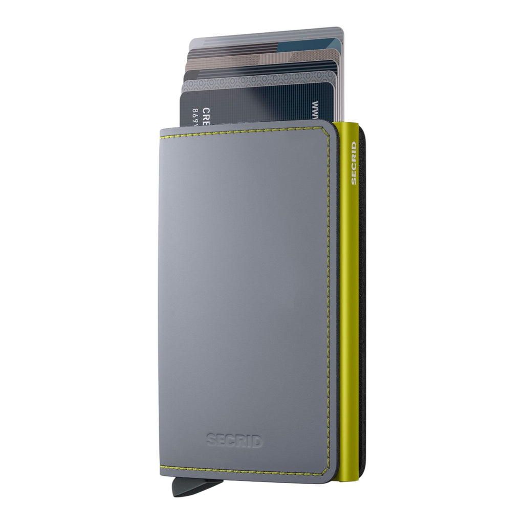 Lieblingstasche Secrid Slimwallet Matte in grey leather with a lime green aluminium card protector and card mechanism.