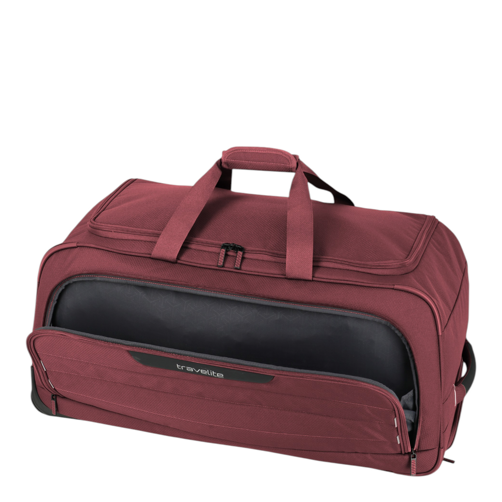 Lieblingstasche Skaii medium wheeled duffle bag in dark red with a front zippered pocket and sturdy top handles.