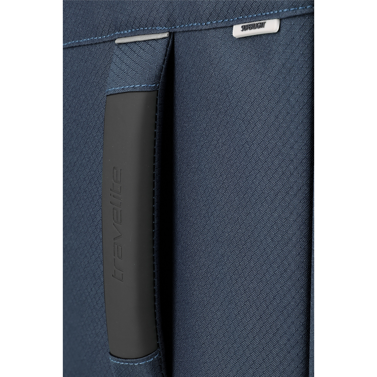 Close-up of the dark blue fabric handle and textured exterior of a Lieblingstasche Skaii Trolley 4W L exp suitcase.