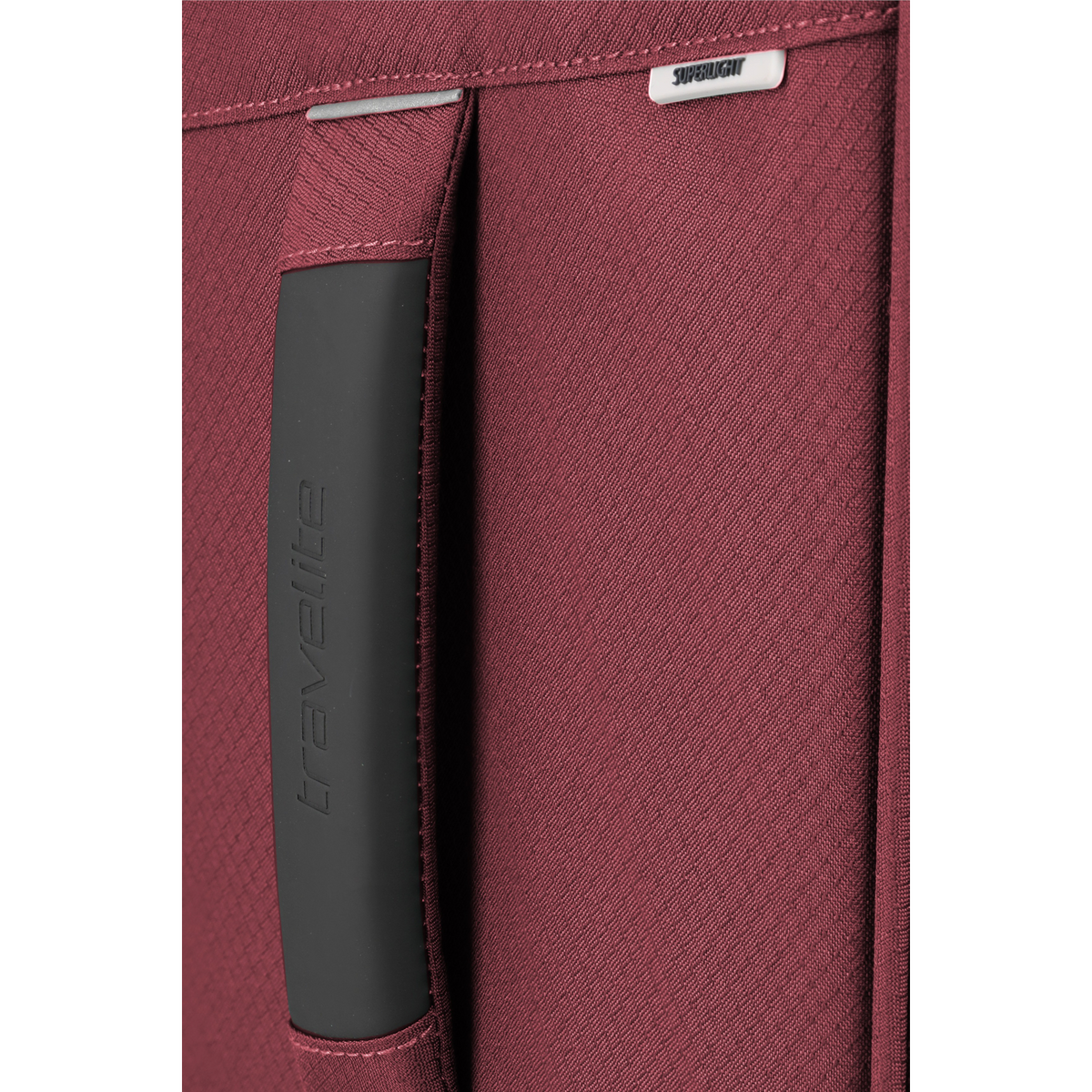 Lieblingstasche Skaii trolley suitcase in burgundy fabric with a black rubberized handle and superlight branding