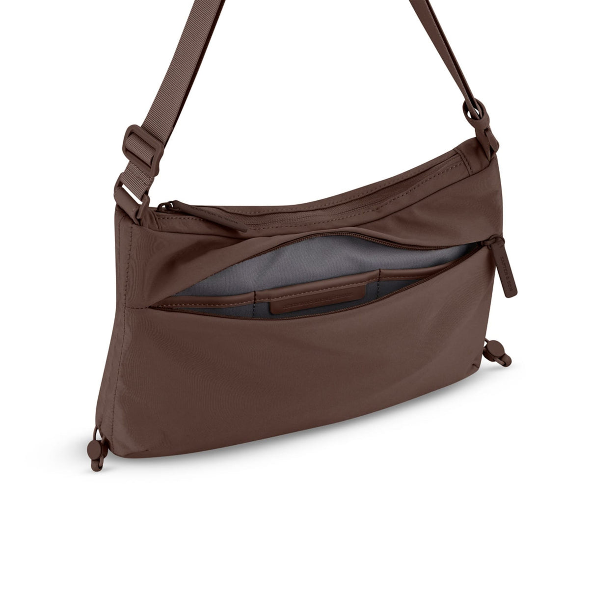 Lieblingstasche Skara Small brown crossbody bag with a front zippered pocket and adjustable strap