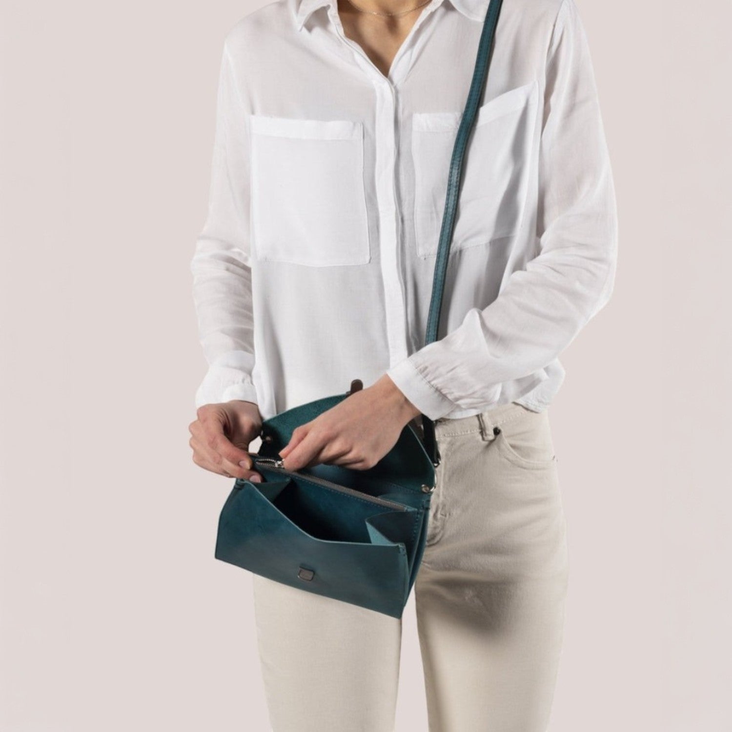 Lieblingstasche teal leather fold handbag clutch with zipper and strap.