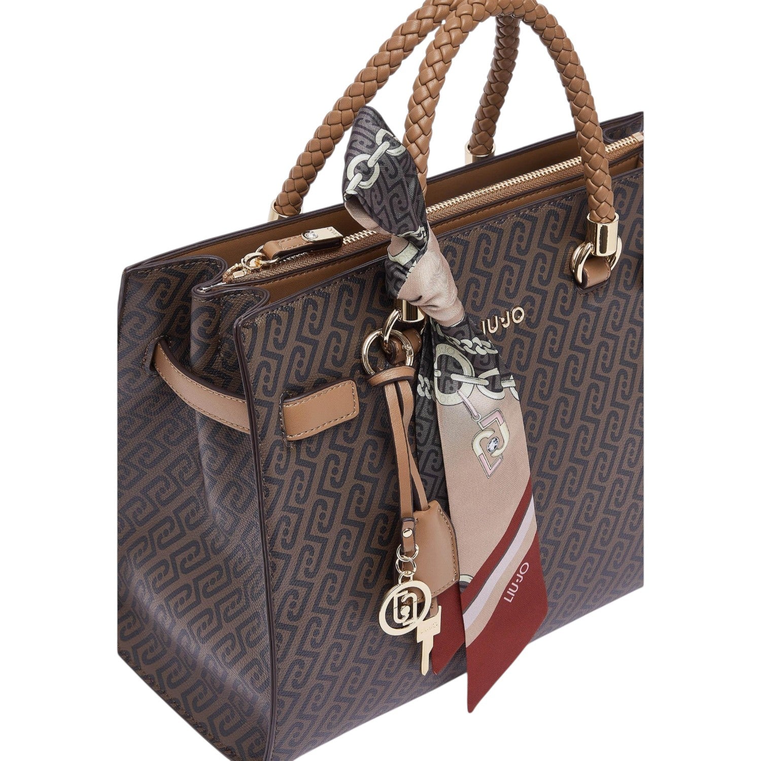 Lieblingstasche Tote M handbag in brown with a monogram pattern, braided handles, and a decorative silk scarf.
