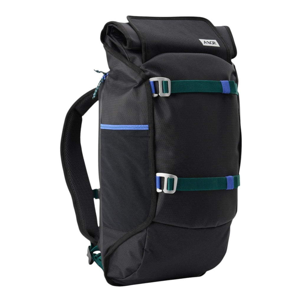 Lieblingstasche Trip Pack black roll-top backpack with green and blue accent straps and side mesh pocket