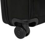 Close-up of the durable black wheel and Tumi logo on a Lieblingstasche Tumi Alpha Compact Carry On suitcase