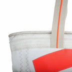 Lieblingstasche white tote bag with orange accent stripe on strap and red patch detail.